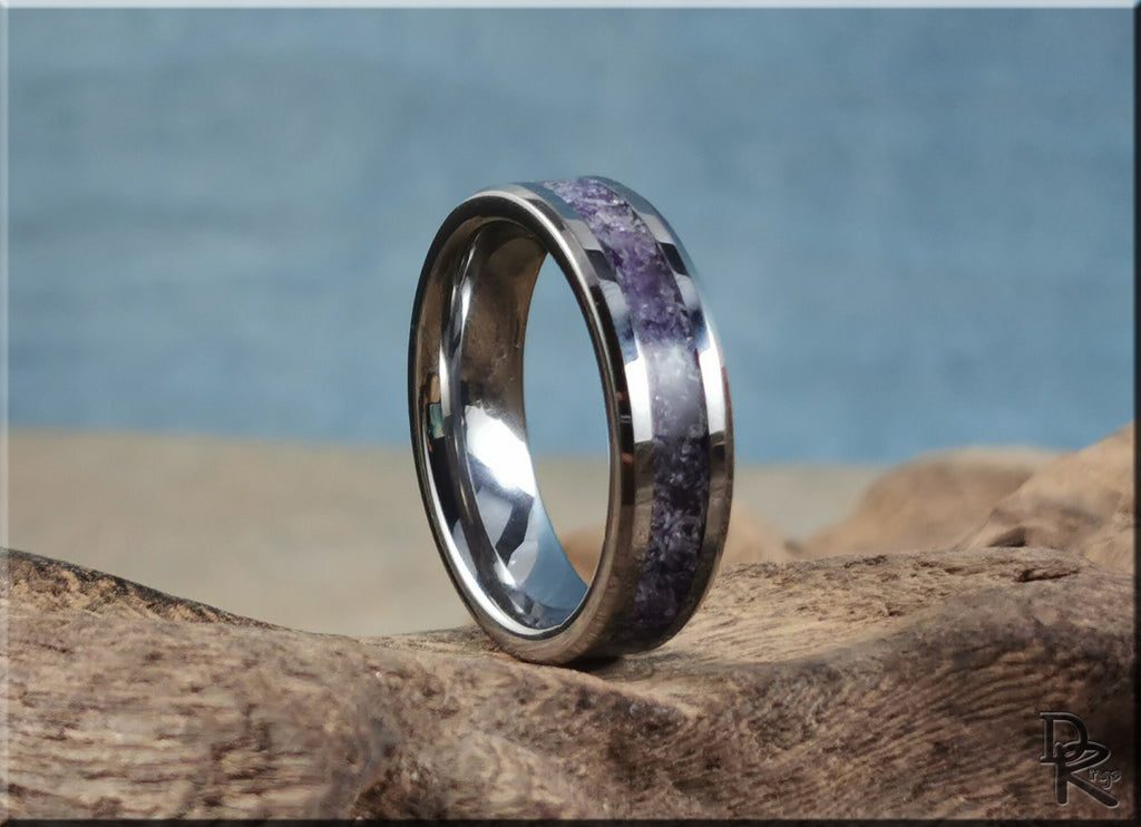 DR Rings tungsten ring with amethyst centered inlay on natural wood surface