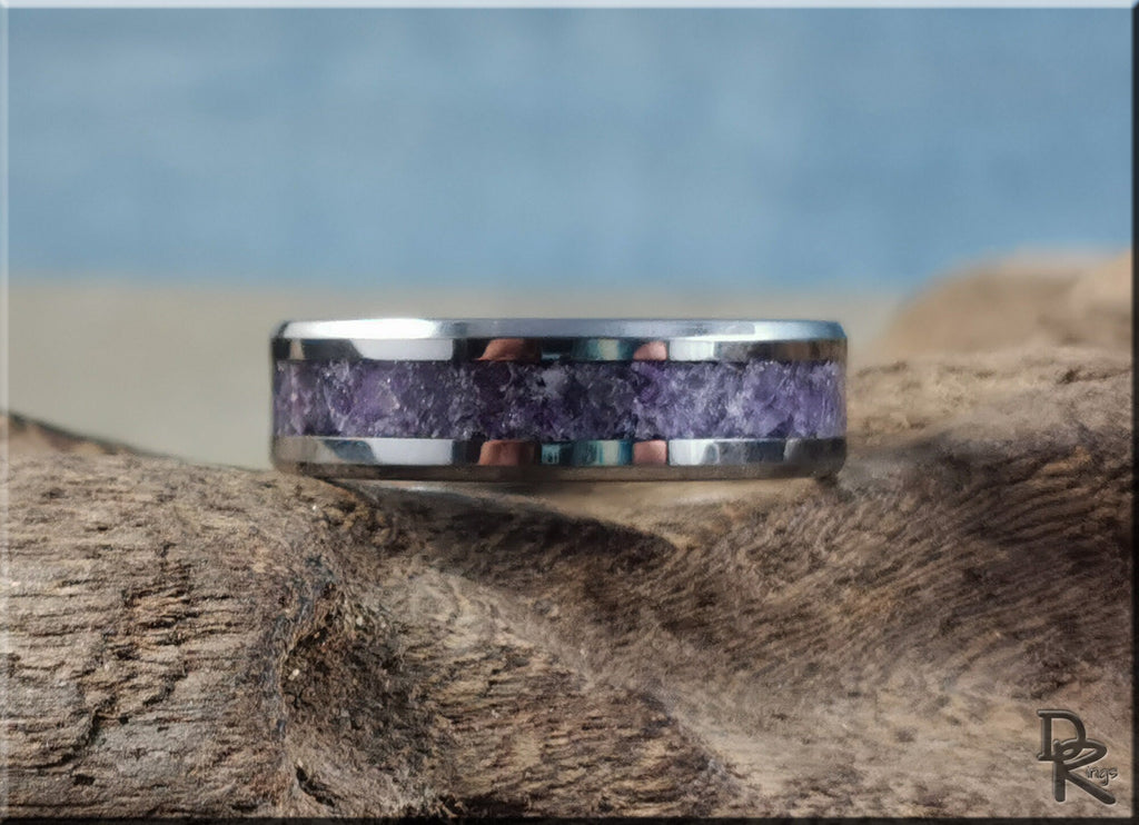 DR Rings tungsten ring with amethyst inlay featuring a polished silver finish on natural wood background