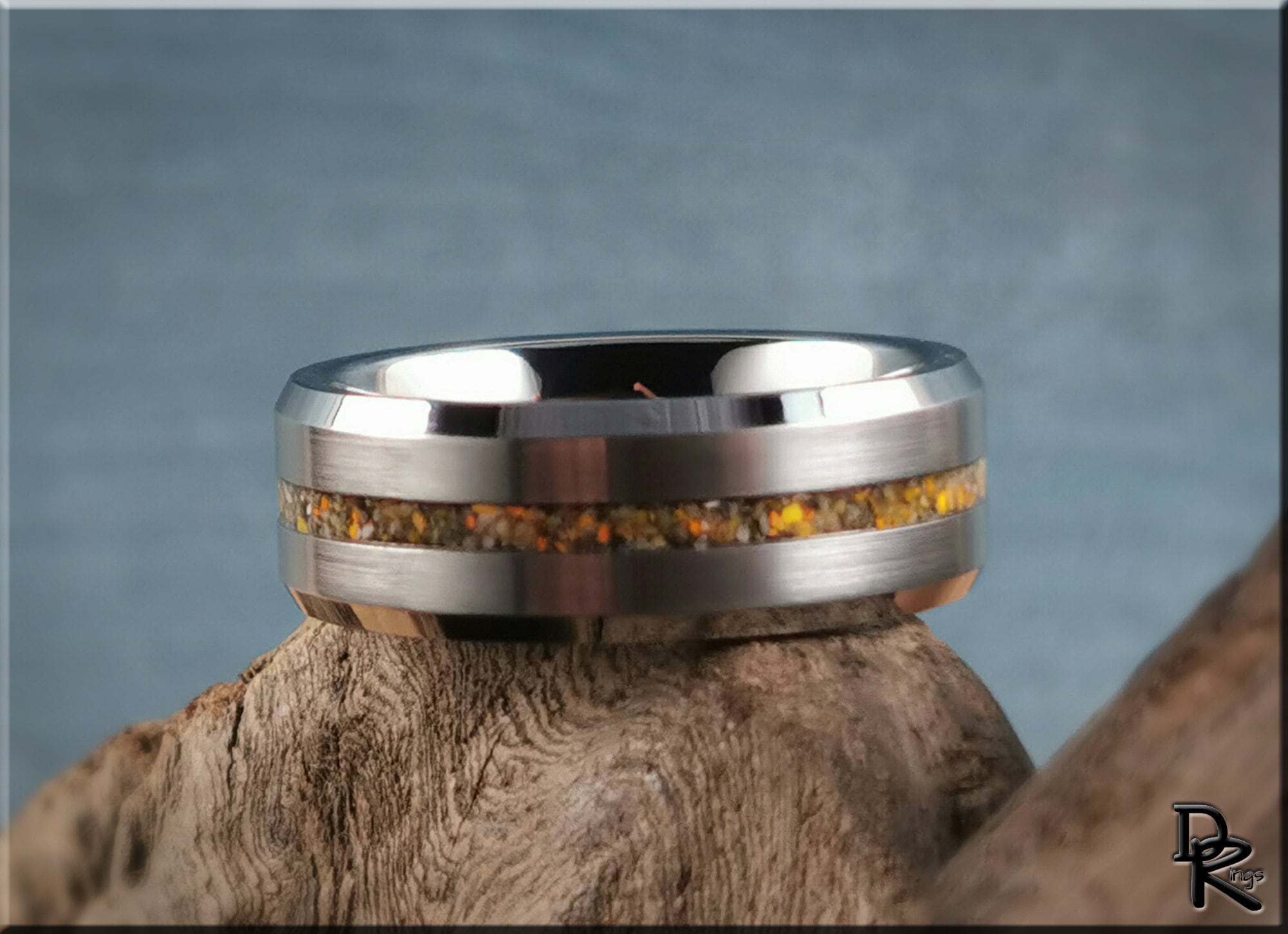 Tungsten ring with jasper inlay featuring a polished silver band and orange jasper stones