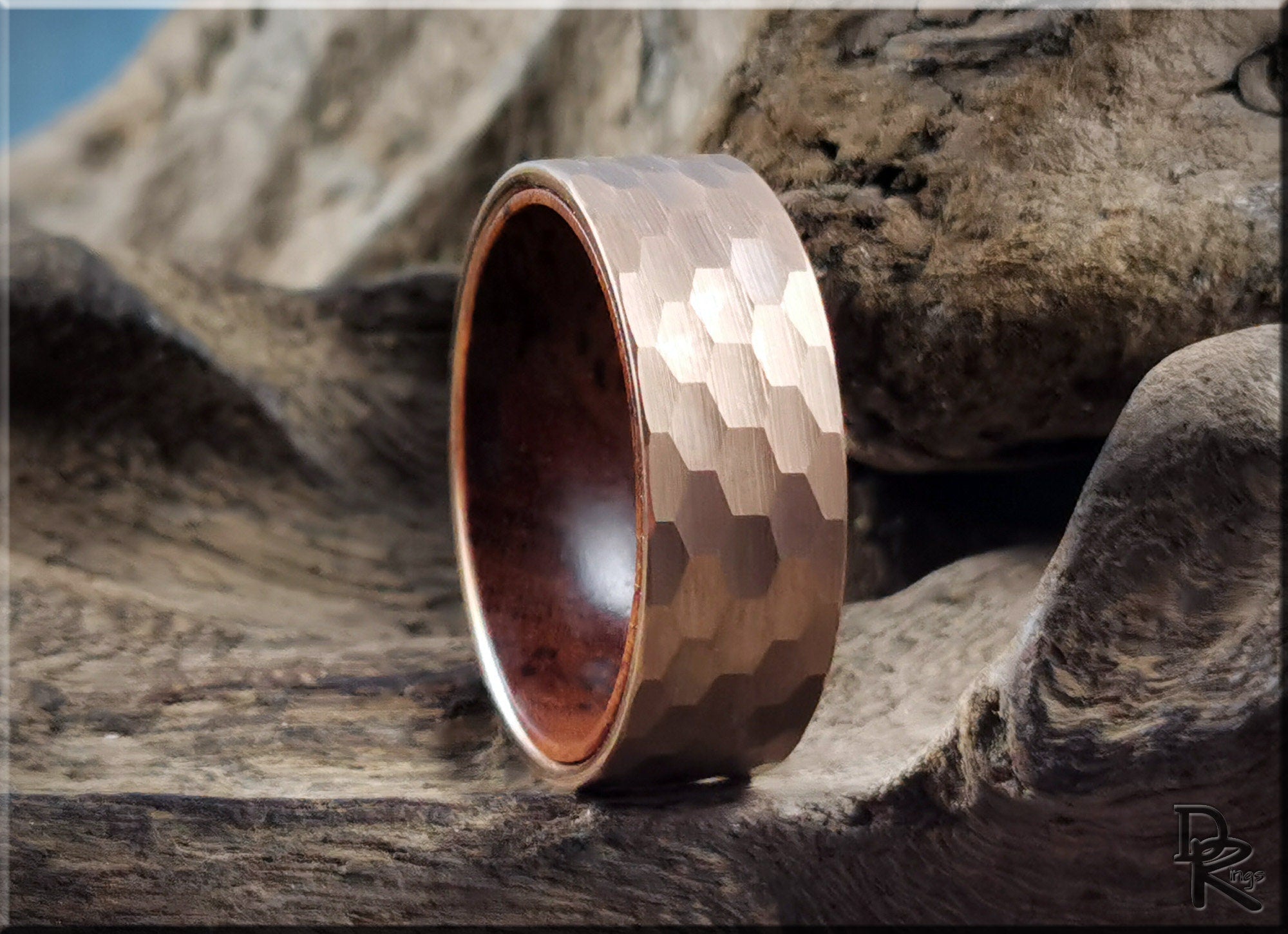 DR Rings tungsten ring with wood liner featuring a hammered texture and rich brown wood interior