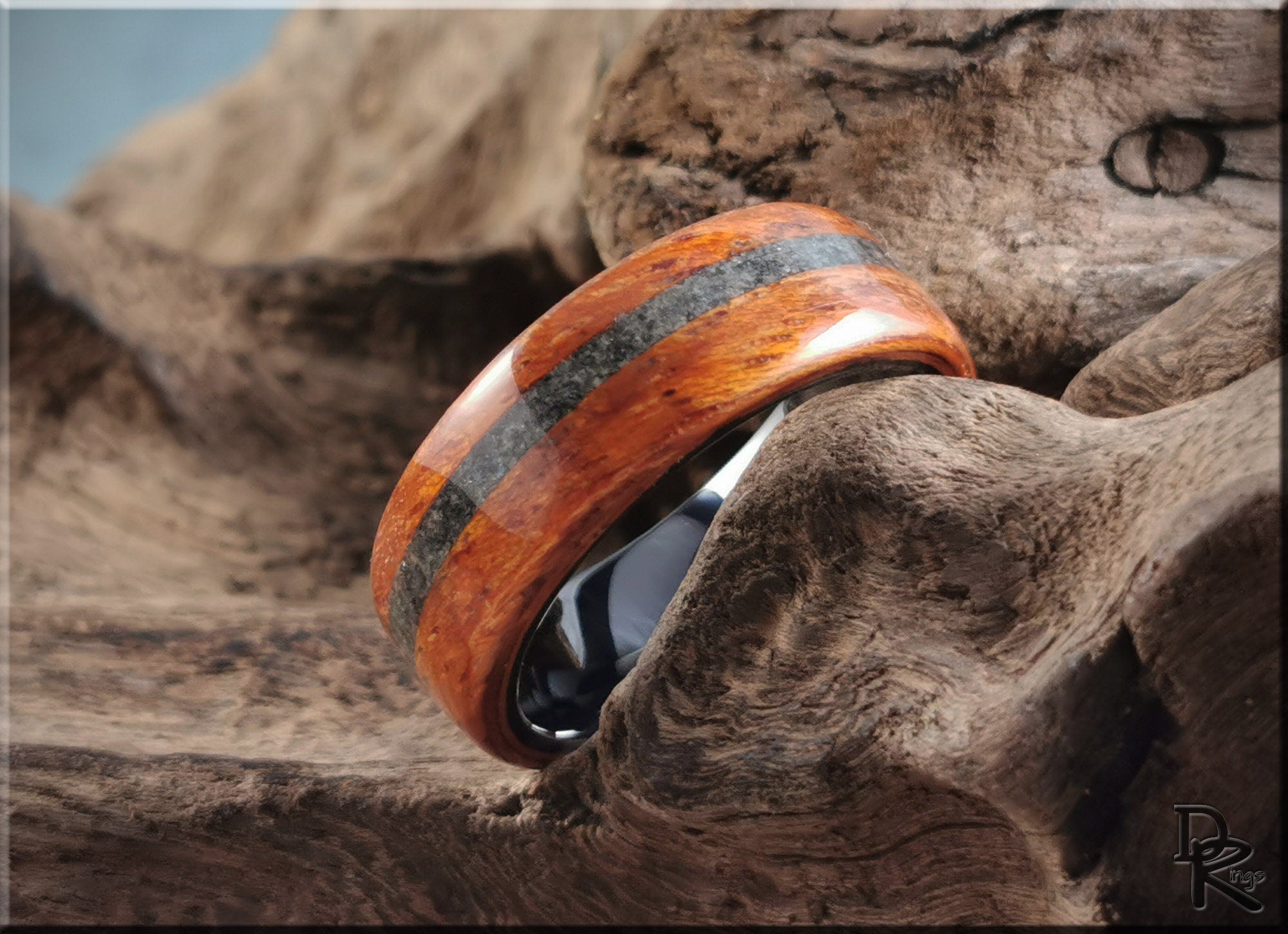 Wood ring with inlay featuring polished brown wood and dark stripe design by DR Rings