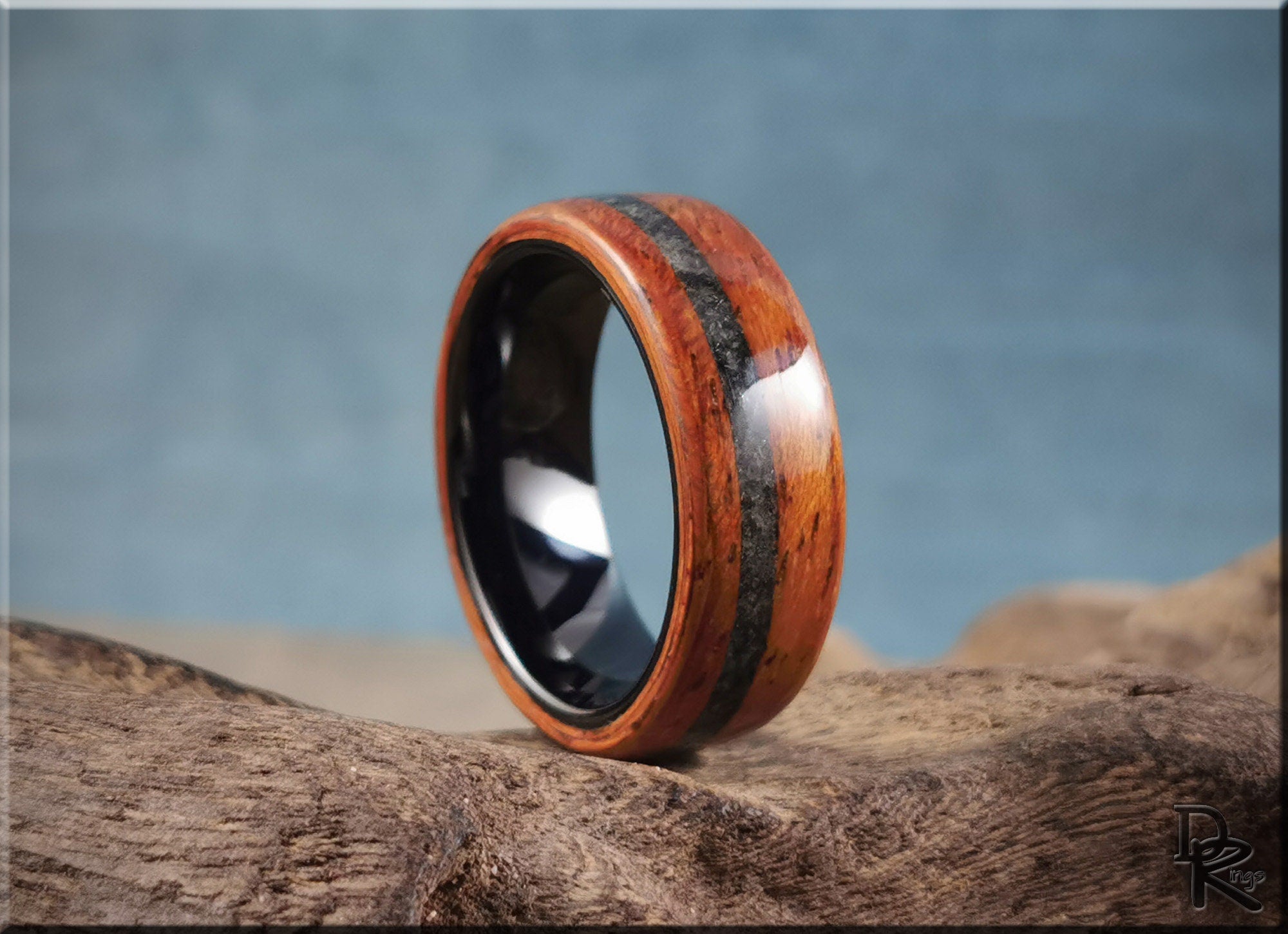 Wood ring with inlay featuring polished dark center and rich reddish wood grain by DR Rings