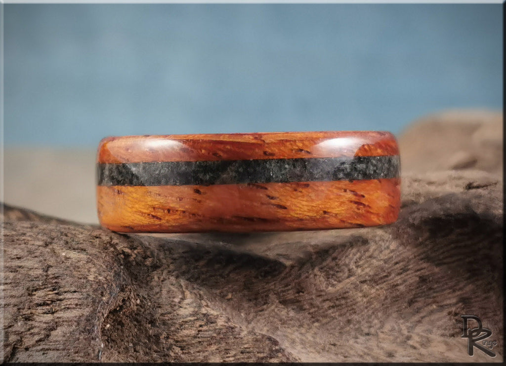 Wood ring with inlay featuring polished reddish wood and black inlay stripe by DR Rings
