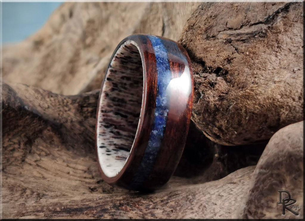 DR Rings wood ring with inlay featuring polished blue and brown wood design on natural background