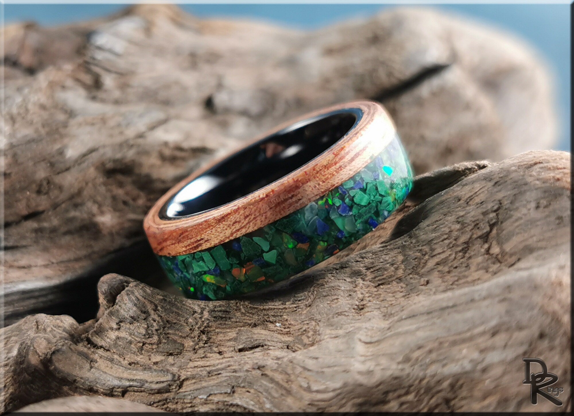 Wood ring with malachite inlay featuring green stone chips and natural wood grain by DR Rings