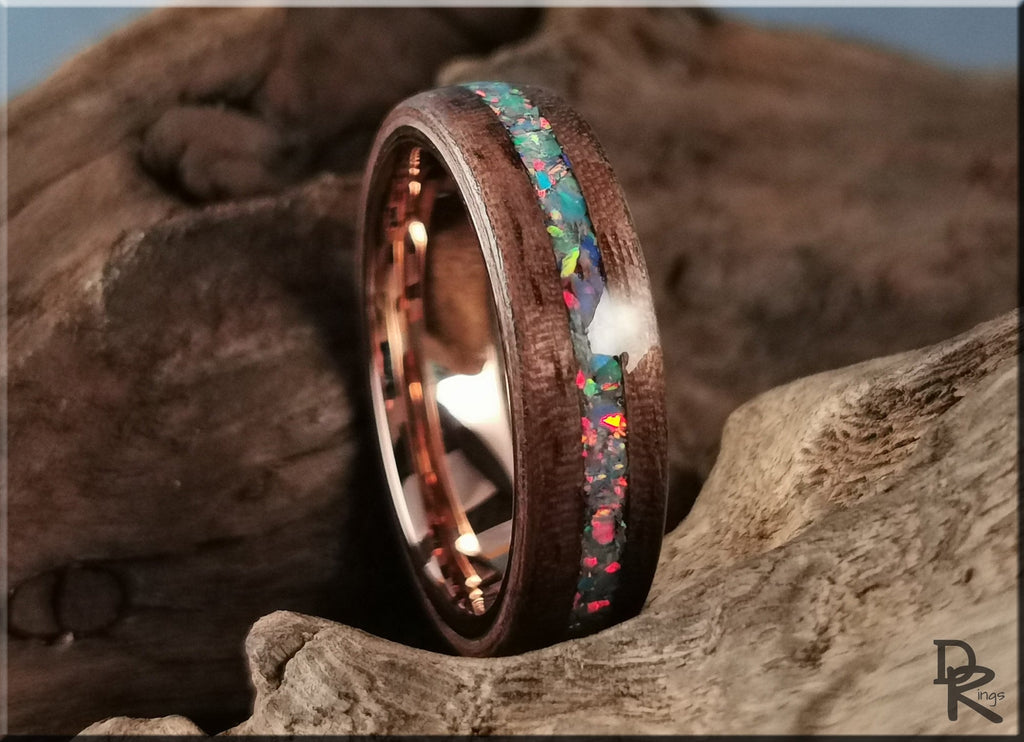 Wood ring with opal inlay featuring vibrant multicolor stones set in dark wooden band by DR Rings