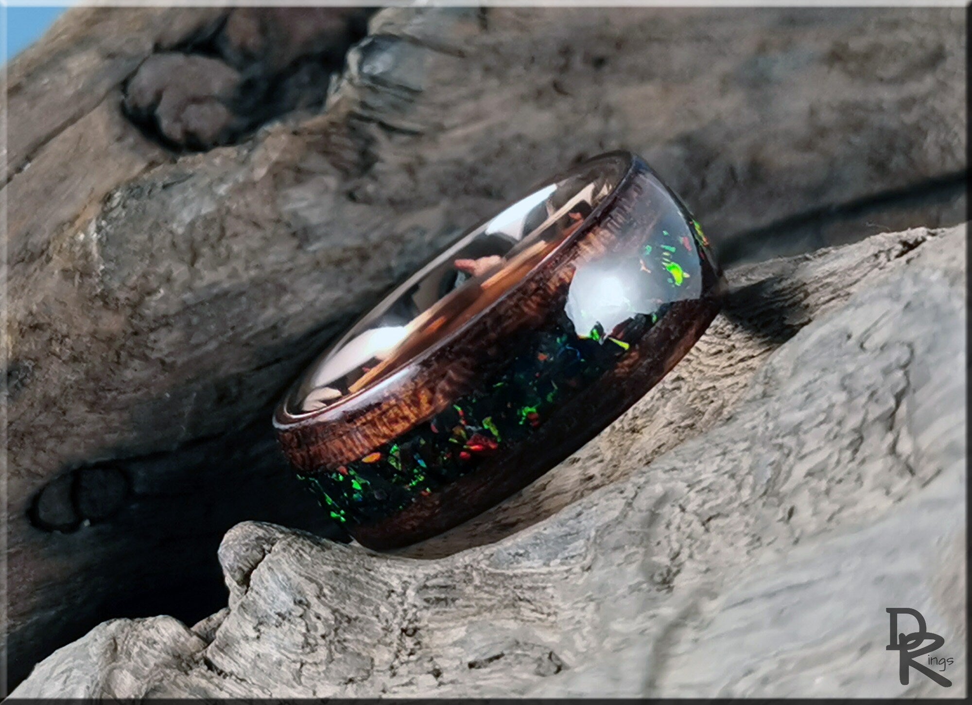 DR Rings wood ring with opal inlay featuring a dark wooden band and vibrant multicolor opal accents