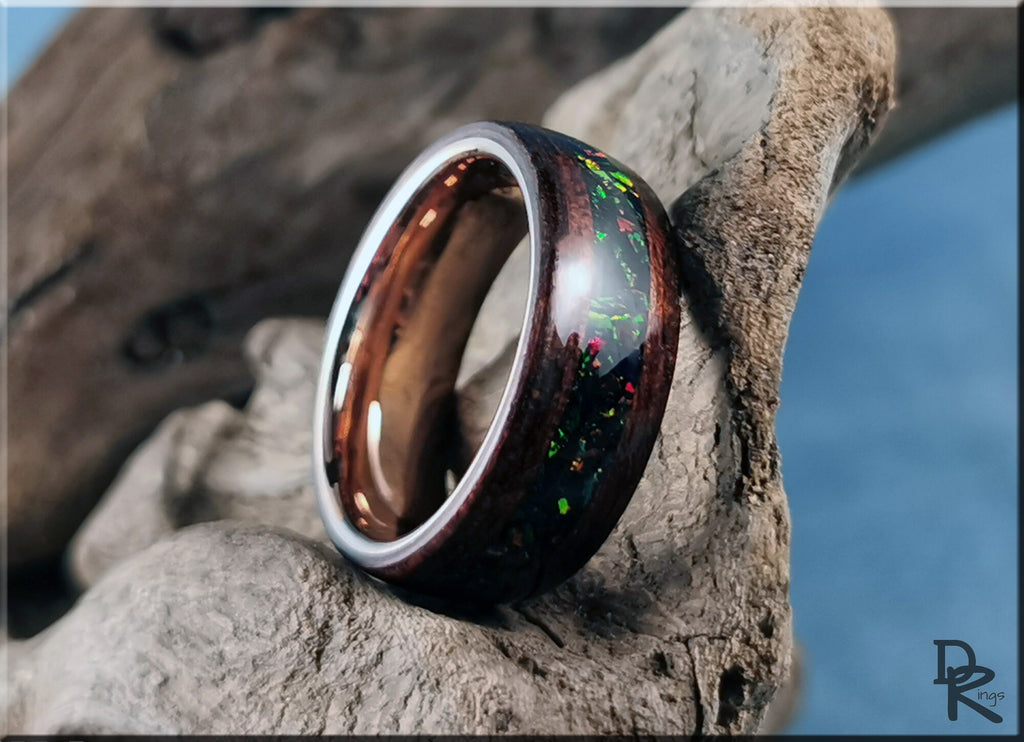DR Rings wood ring with opal inlay featuring colorful iridescent accents on natural wood