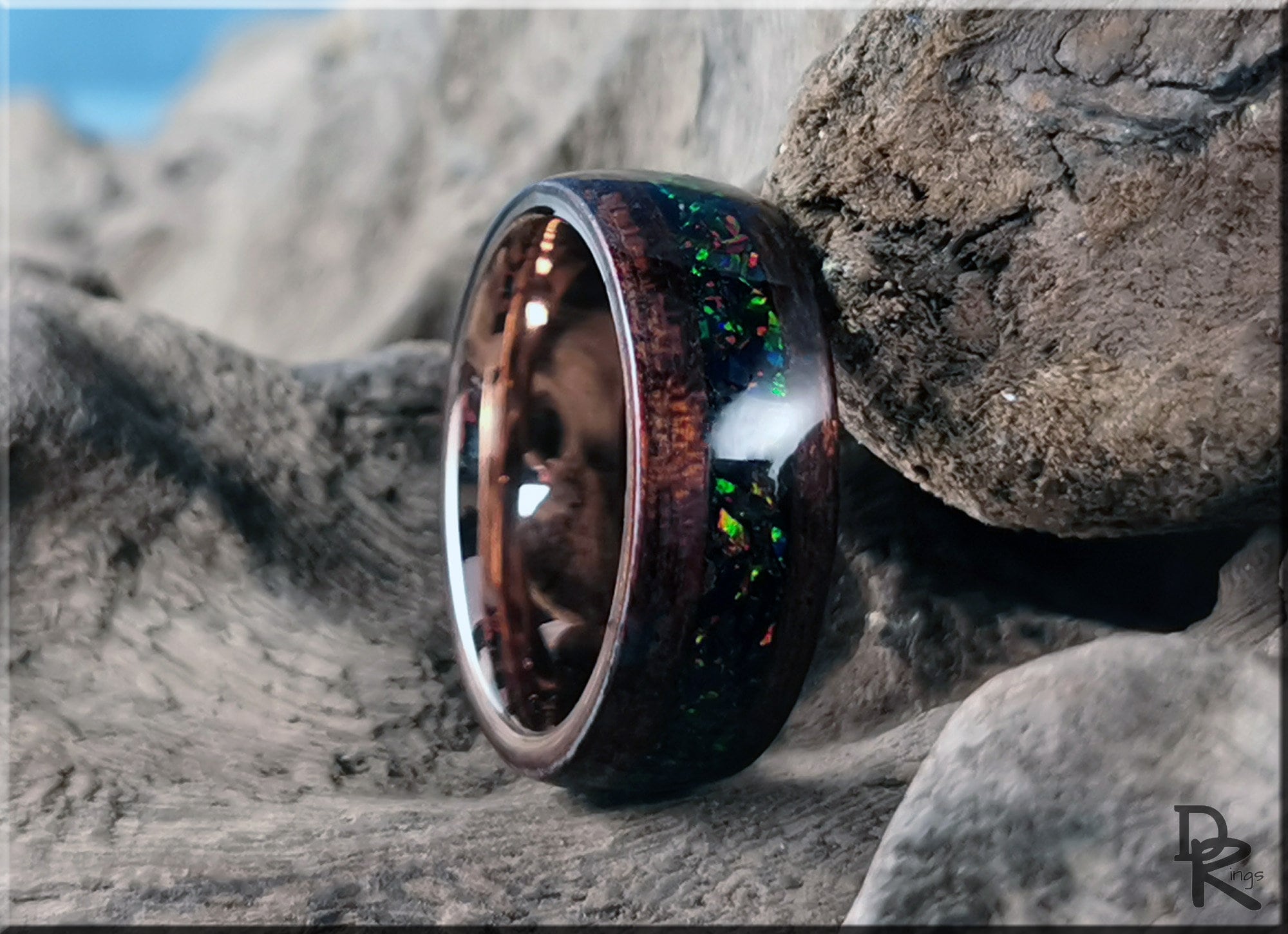 DR Rings wood ring with opal inlay featuring dark wood and vibrant colorful opal accents