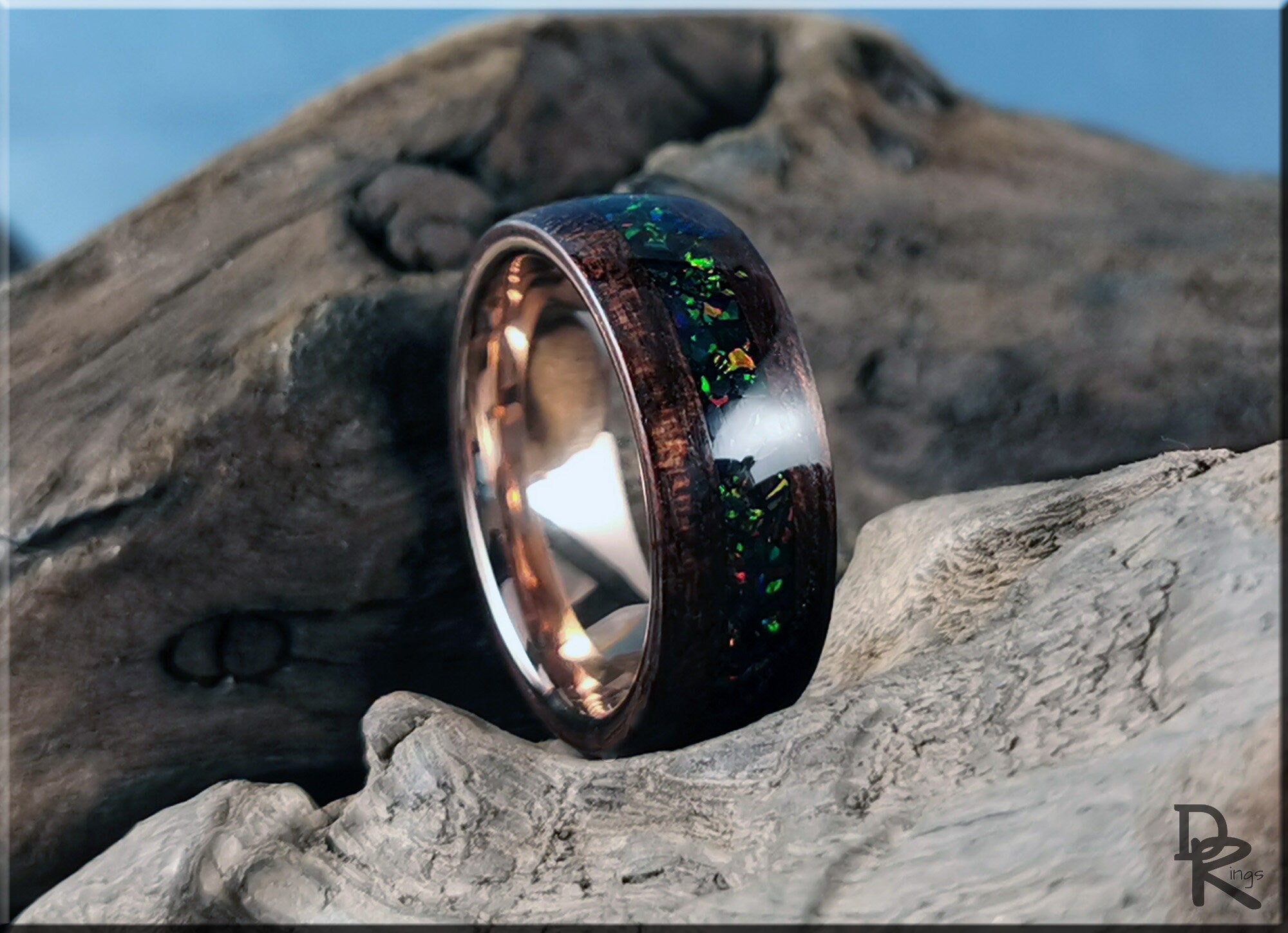 DR Rings wood ring with opal inlay featuring dark wood and shimmering colorful opal details