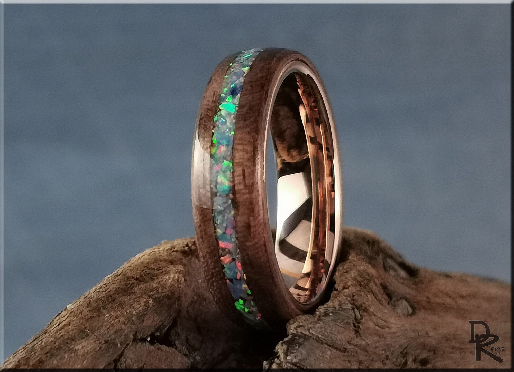Wood ring with opal inlay featuring colorful iridescent stones and polished finish by DR Rings