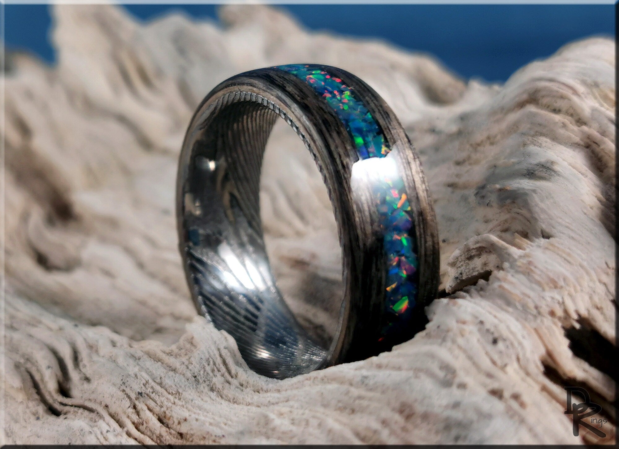 Wood ring with opal inlay by DR Rings featuring vibrant blue and green opal design on natural wood band
