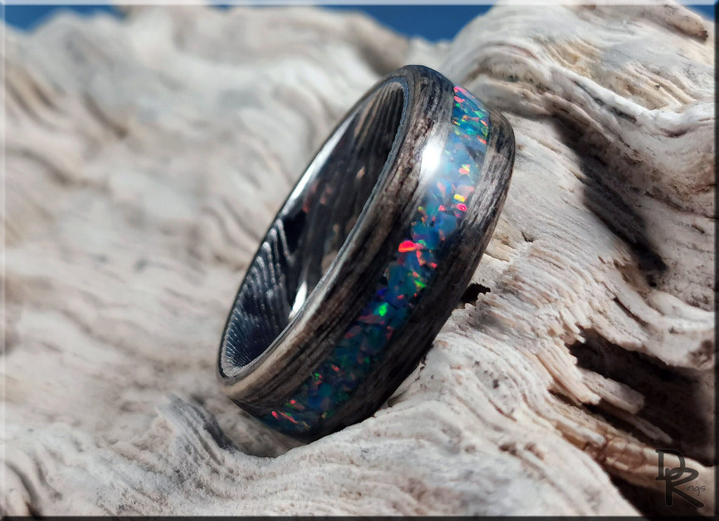 Wood ring with opal inlay featuring vibrant multicolor opal embedded in dark wood band by DR Rings