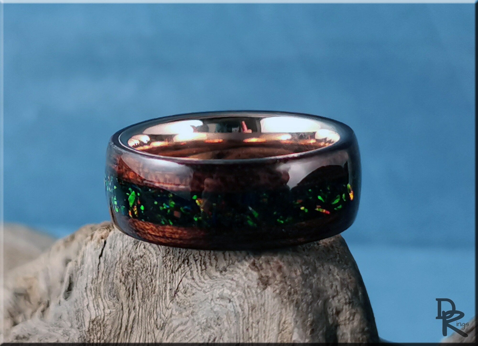 DR Rings wood ring with opal inlay featuring a polished wooden band and vibrant green opal accents