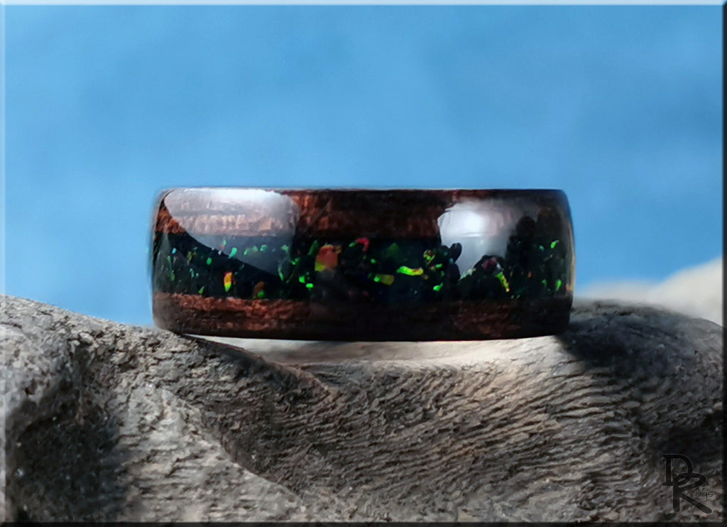 DR Rings wood ring with opal inlay featuring dark wood and vibrant green opal accents