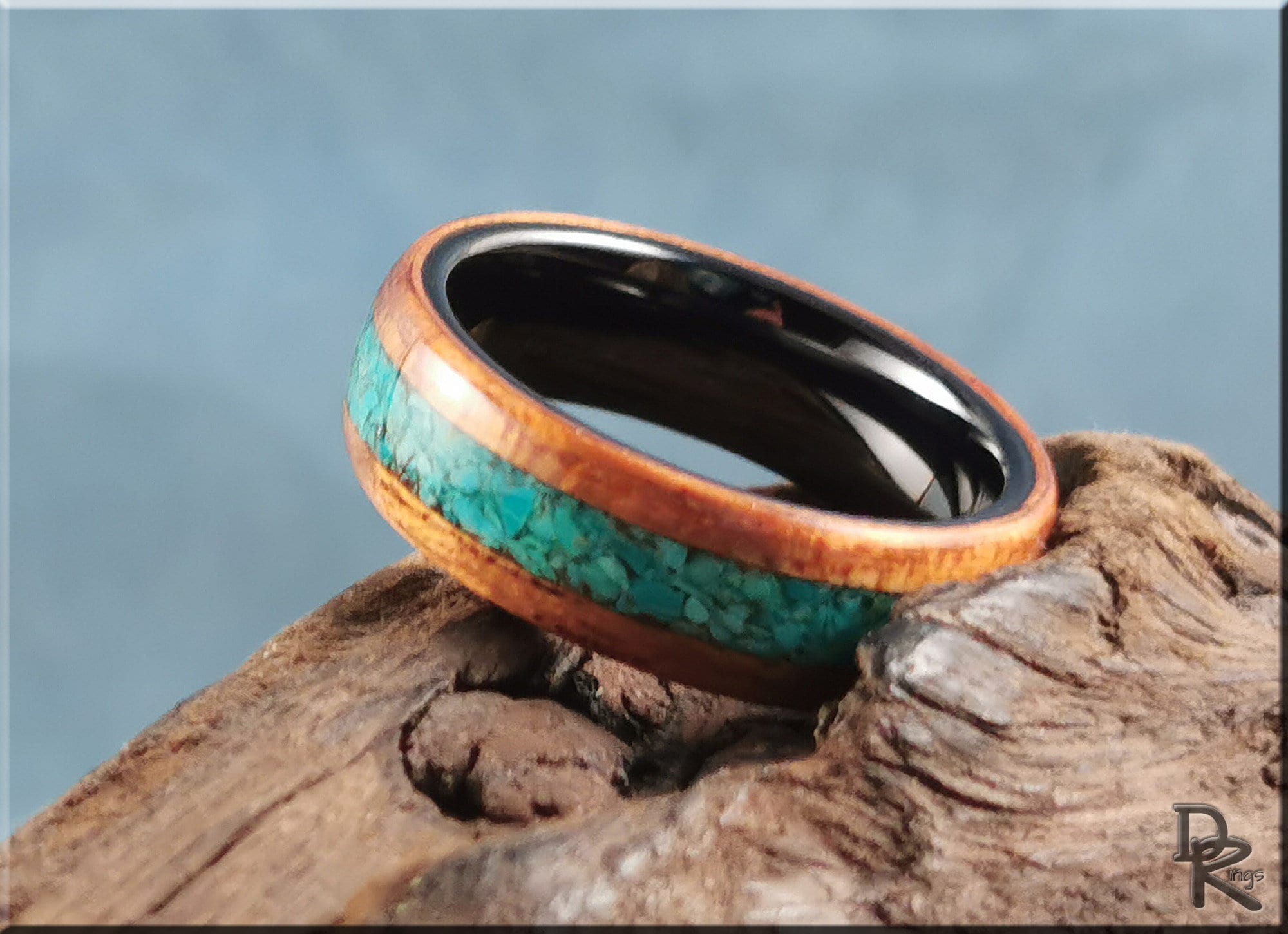 Wood ring with stone inlay featuring turquoise stone center and polished wooden edges