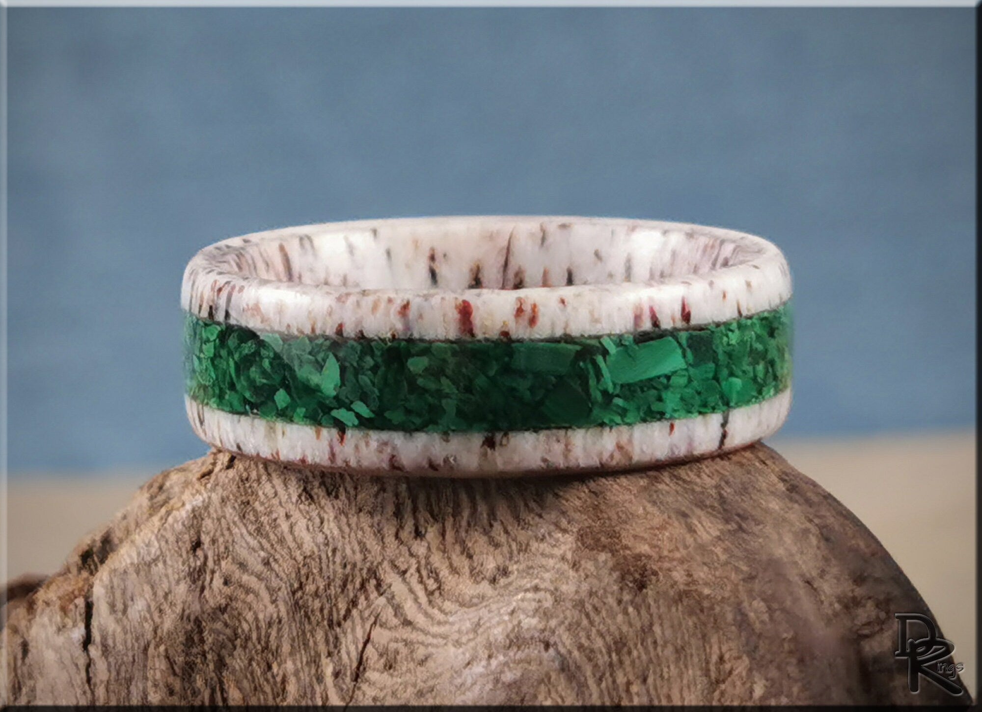 DR Rings antler ring with white and brown natural antler and green inlay band on rustic wood