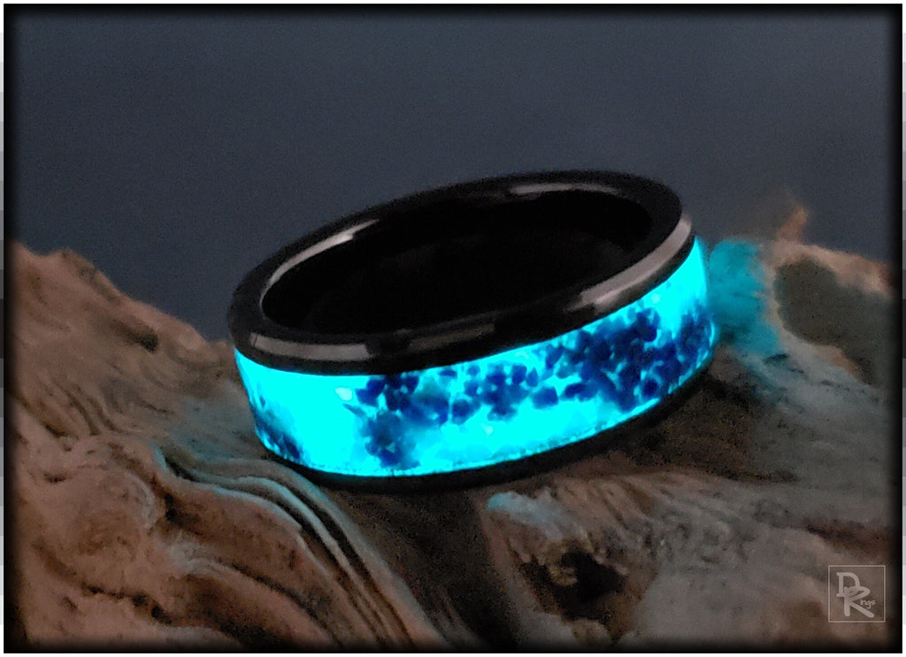 DR Rings ceramic ring with glow inlay emitting bright blue light on textured surface