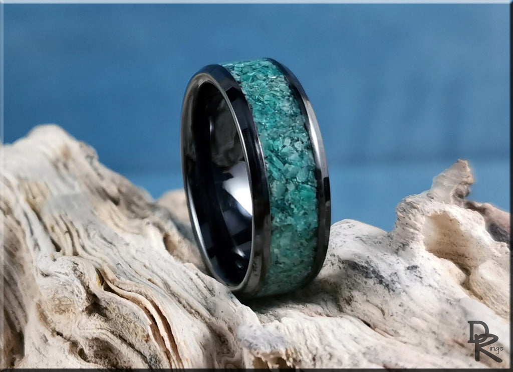 DR Rings black ceramic ring with inlay featuring turquoise stone on rustic wood background