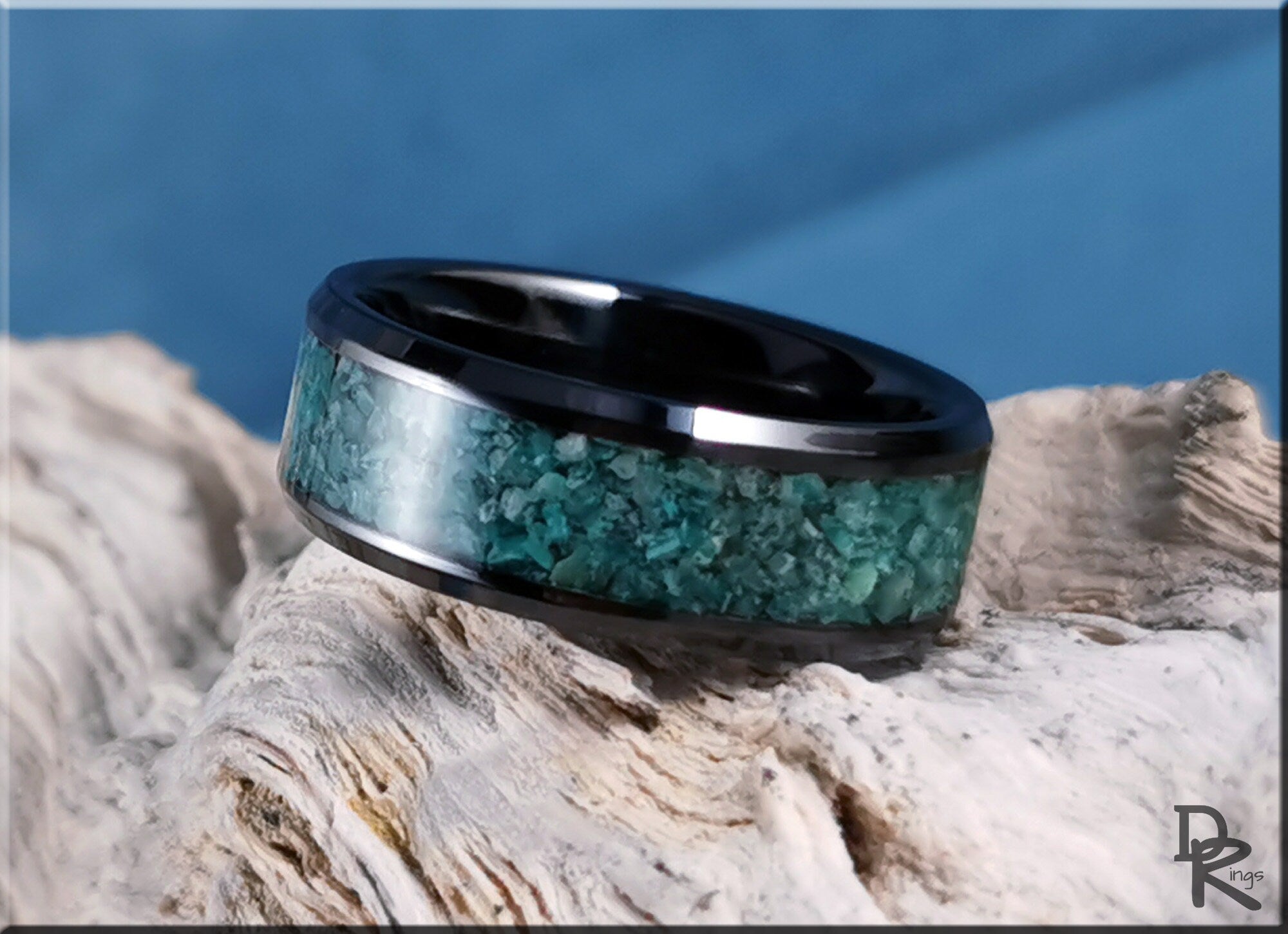 DR Rings black ceramic ring with inlay featuring turquoise stone detail on textured surface