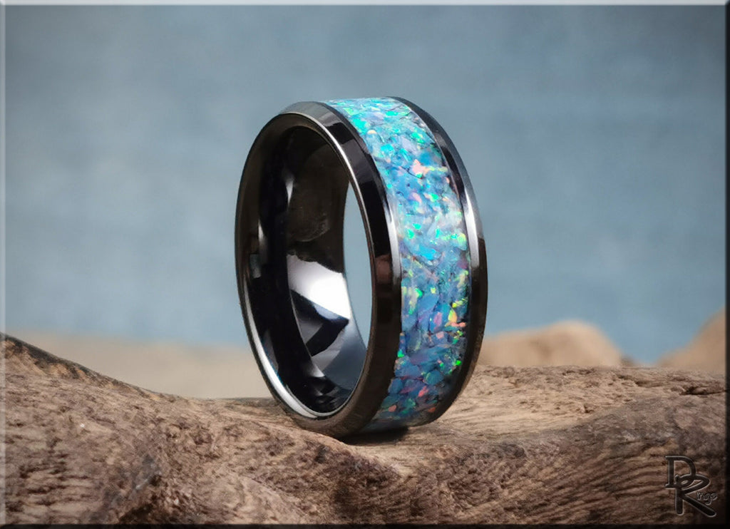 DR Rings ceramic ring with opal inlay featuring vibrant blue and green opal stones on black ceramic band