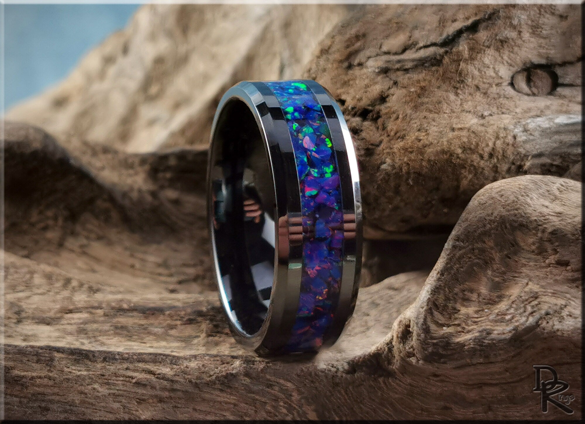 DR Rings ceramic ring with opal featuring vibrant blue and green inlay on black band