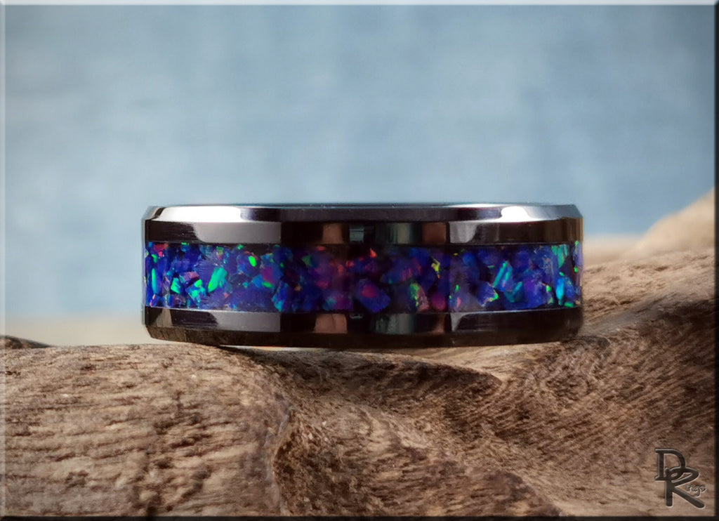 DR Rings ceramic ring with opal inlay featuring vibrant blue and green colors on a polished band