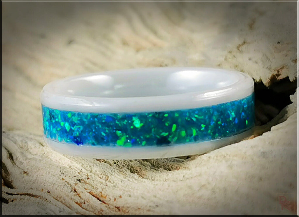 DR Rings ceramic ring with opal featuring a white band and vibrant blue-green opal inlay