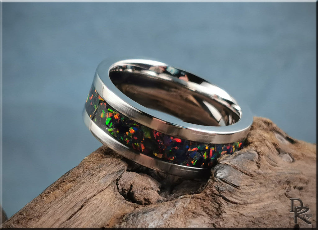 Cobalt chrome ring with opal inlay featuring vibrant multicolor patterns on a polished silver band