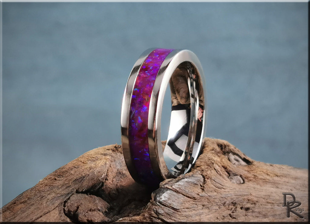 DR Rings cobalt chrome ring with opal featuring vibrant purple inlay on rustic wood background