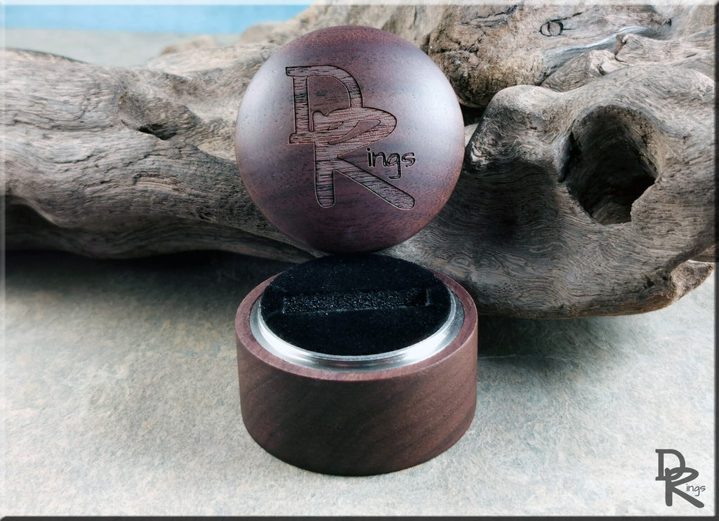 DR Rings walnut ring box with engraved logo and circular design for elegant ring storage
