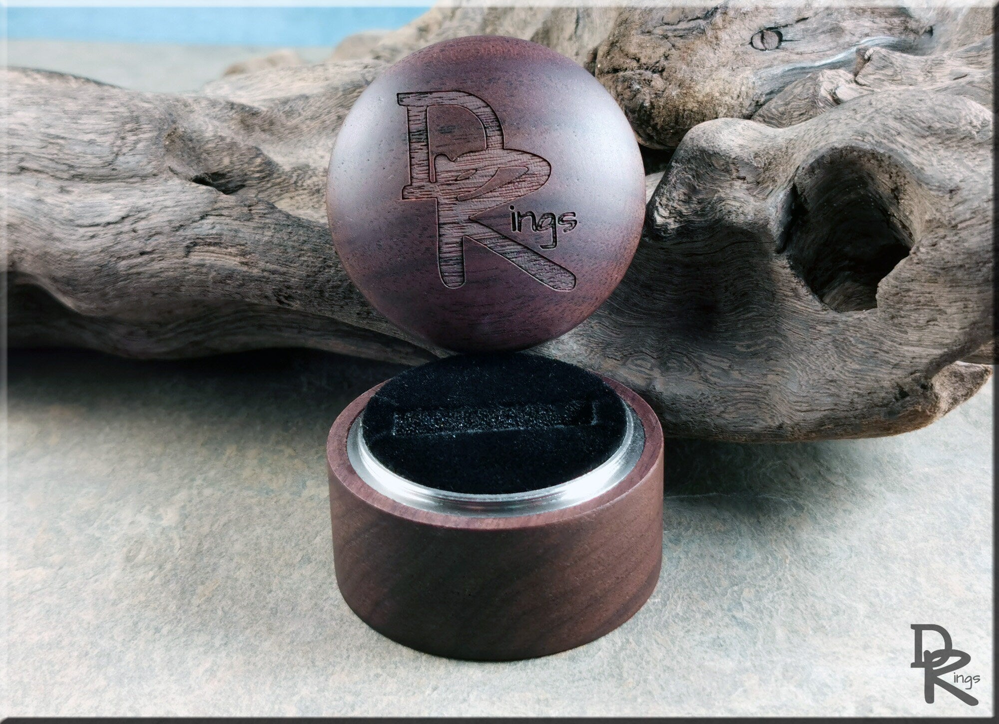 DR Rings walnut ring box with engraved logo and circular design for elegant ring storage