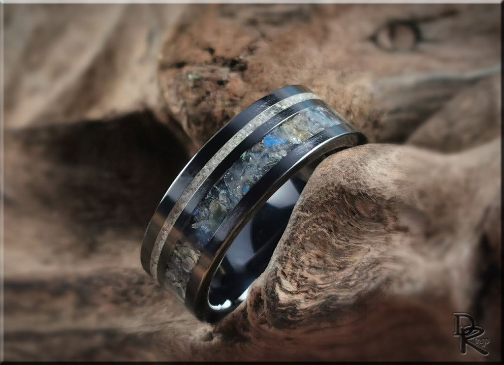 DR Rings black ceramic ring with dual inlays featuring a textured stone center and sleek polished edges