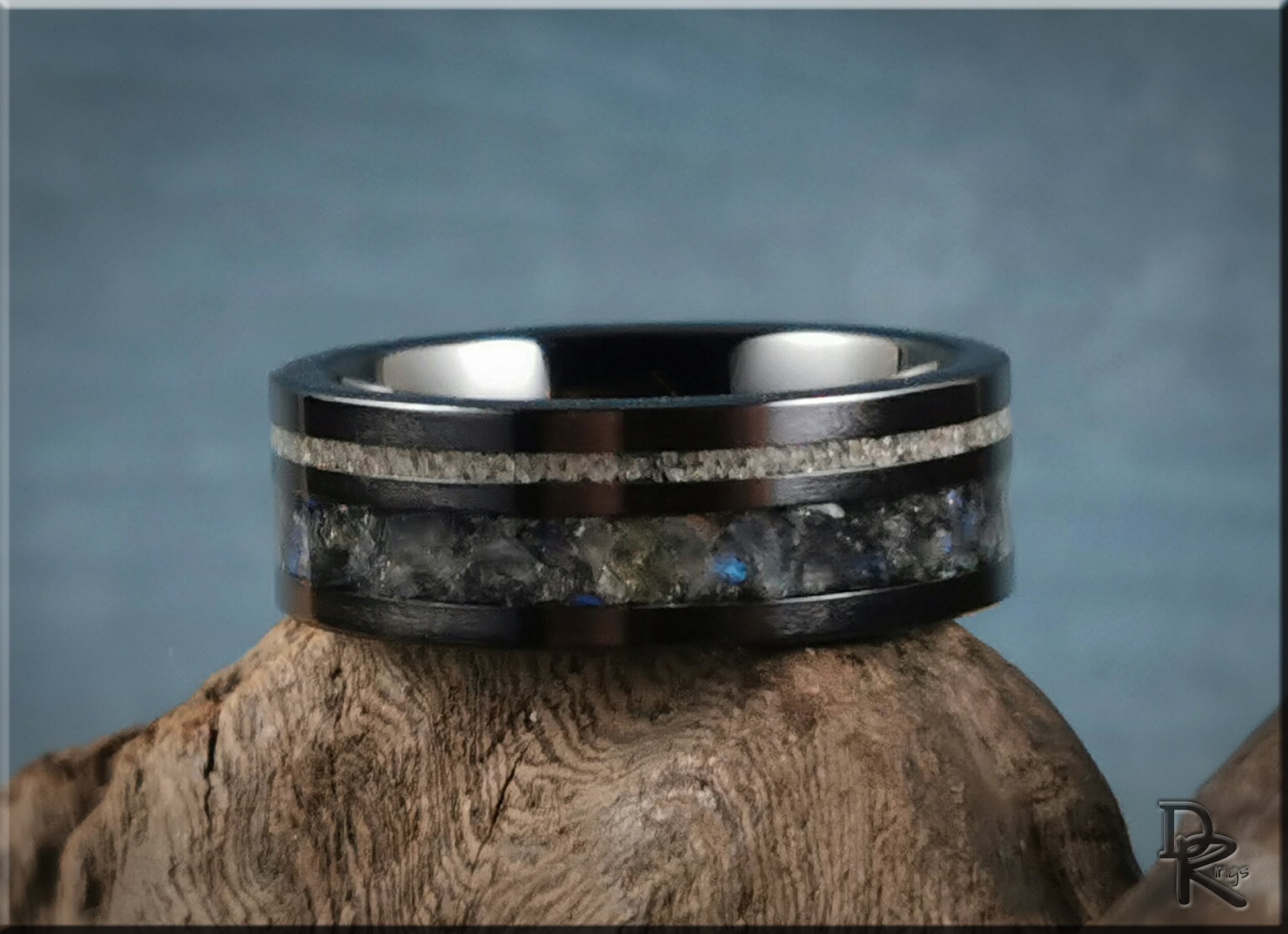 Black ceramic ring with dual inlays featuring textured silver and stone design by DR Rings
