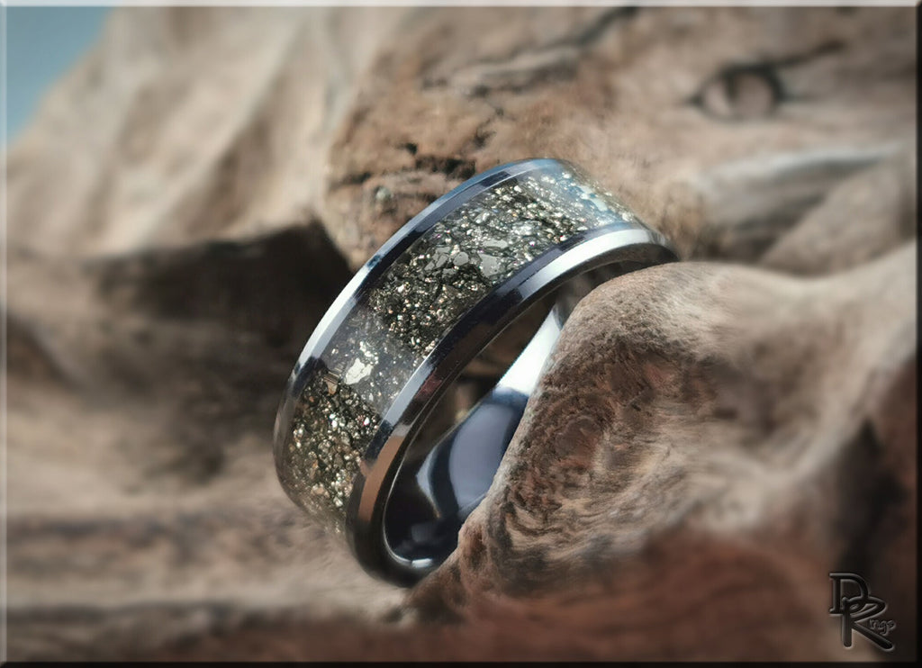 DR Rings ceramic ring with pyrite featuring a shiny metallic band and embedded sparkling pyrite stones