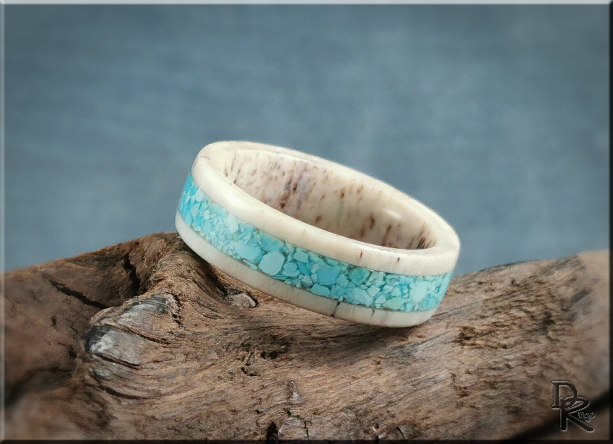 Deer antler ring with turquoise inlay featuring natural textures and blue stone detailing