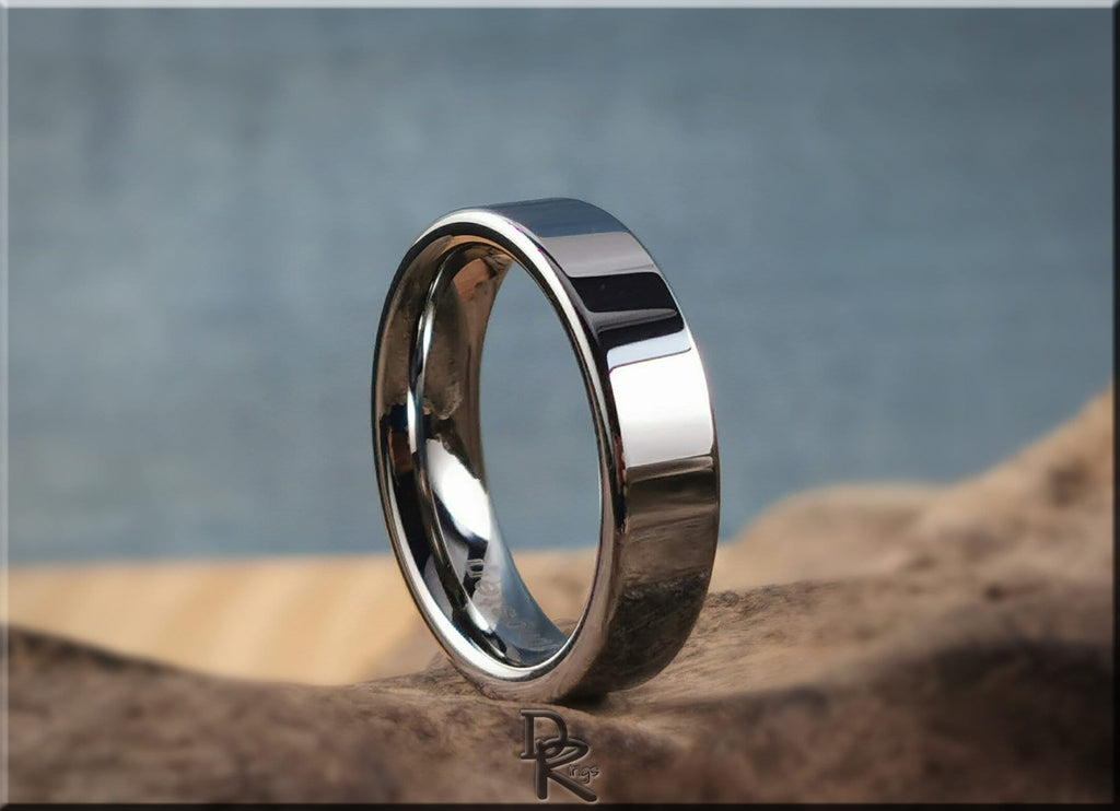 DR Rings polished tungsten ring carbide with a smooth reflective surface on a natural background