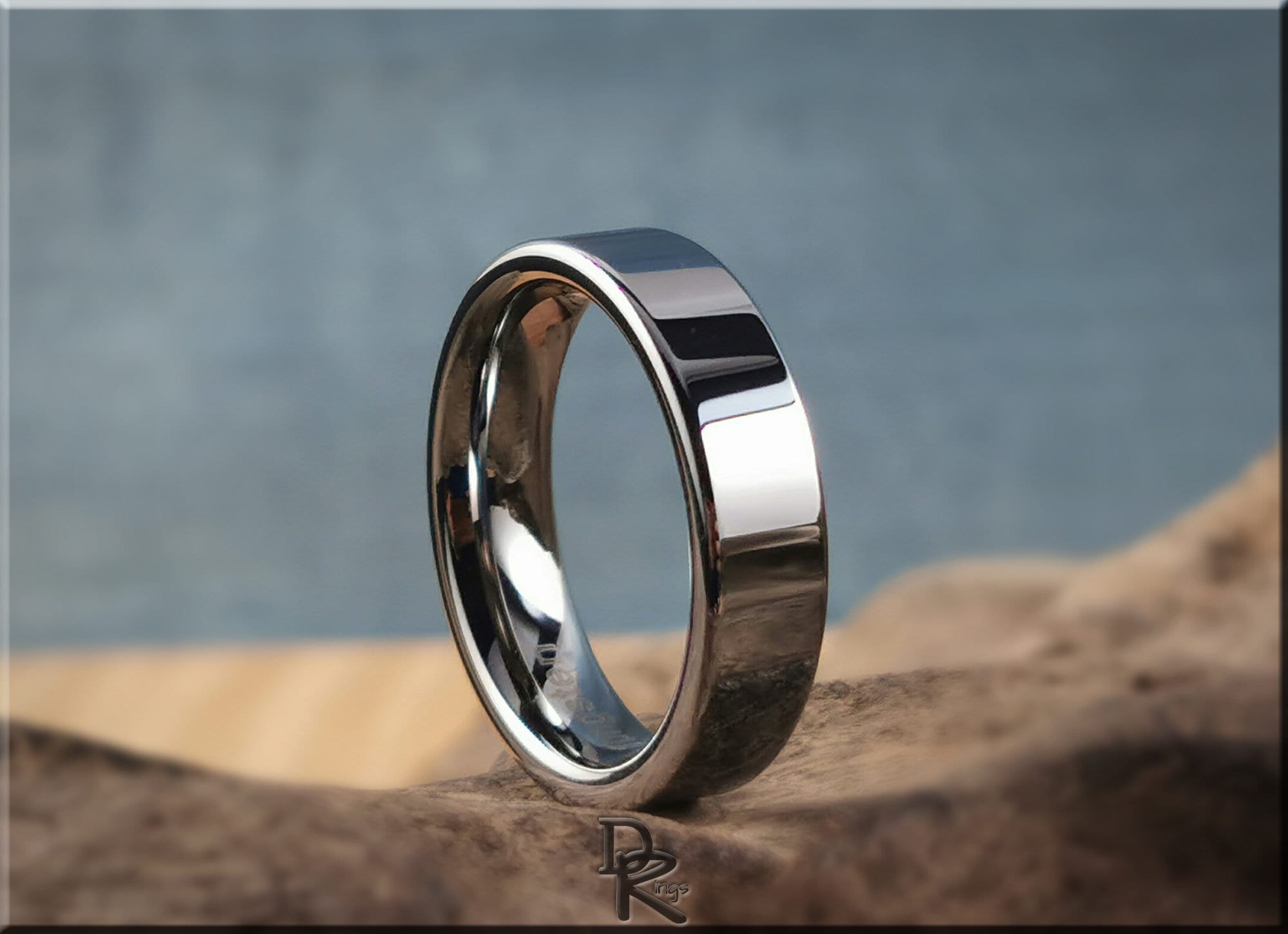 DR Rings polished tungsten ring carbide with a smooth reflective surface on a natural background