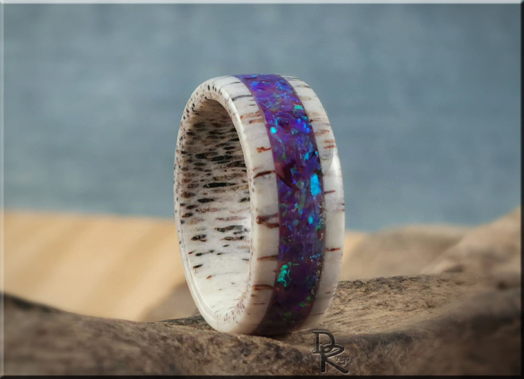 Deer antler ring with opal inlay featuring vibrant blue and purple stones and natural antler texture
