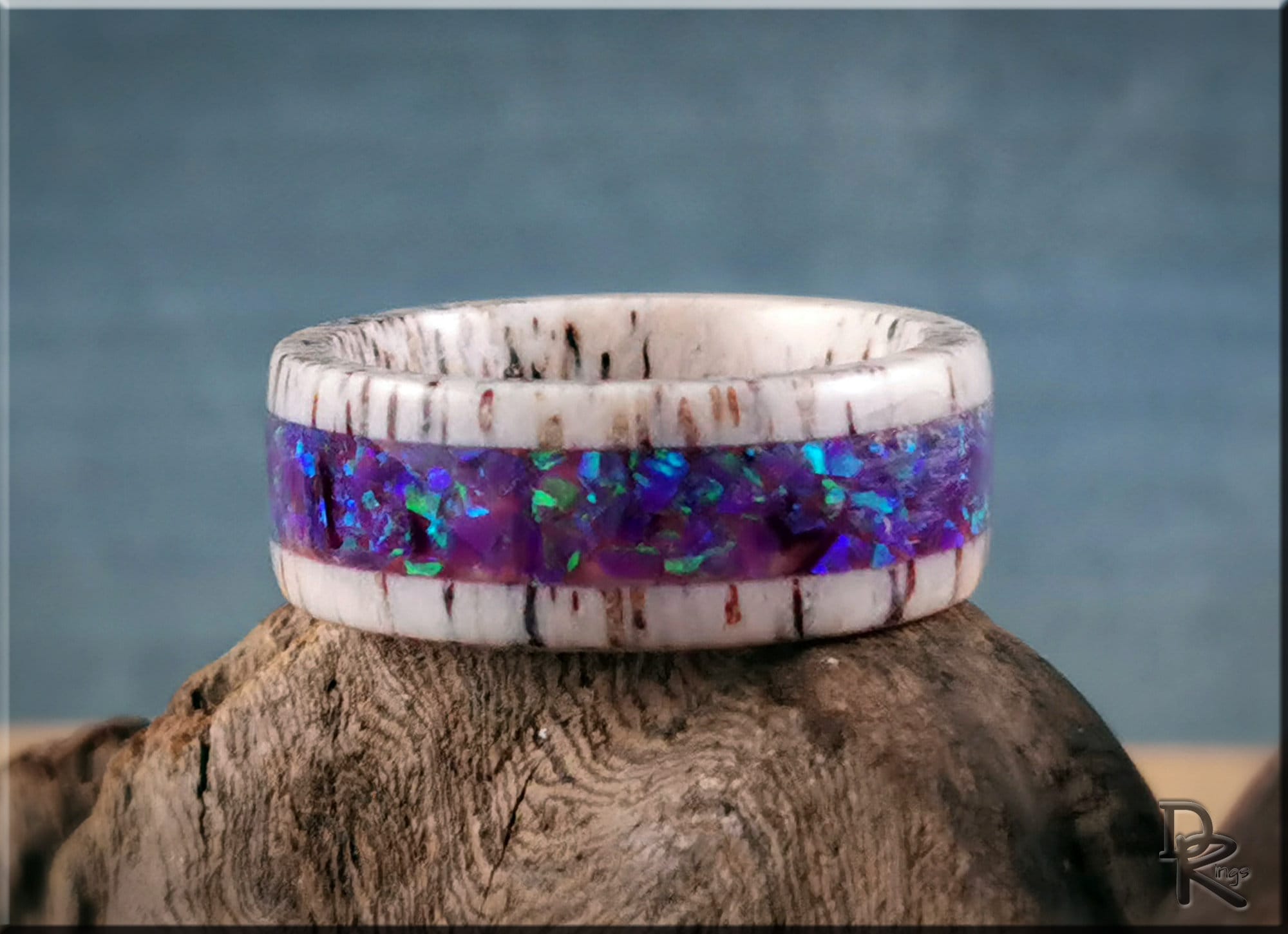 Deer antler ring with opal inlay featuring vibrant purple and blue opal accents by DR Rings