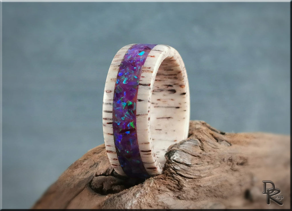 Deer antler ring with opal inlay featuring a purple opal center band and natural antler texture