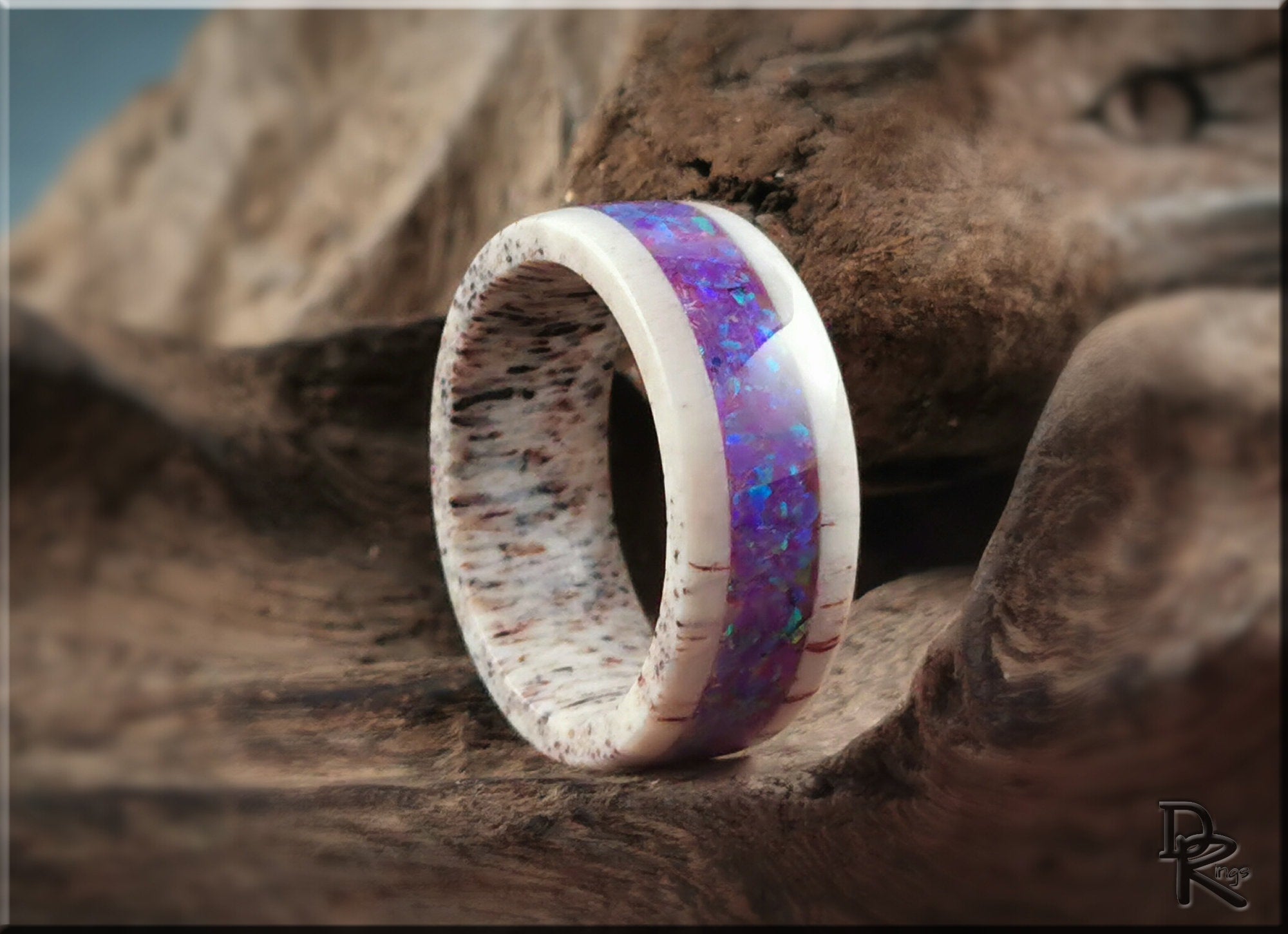 Deer antler ring with opal inlay by DR Rings featuring a bright purple opal center and natural antler texture