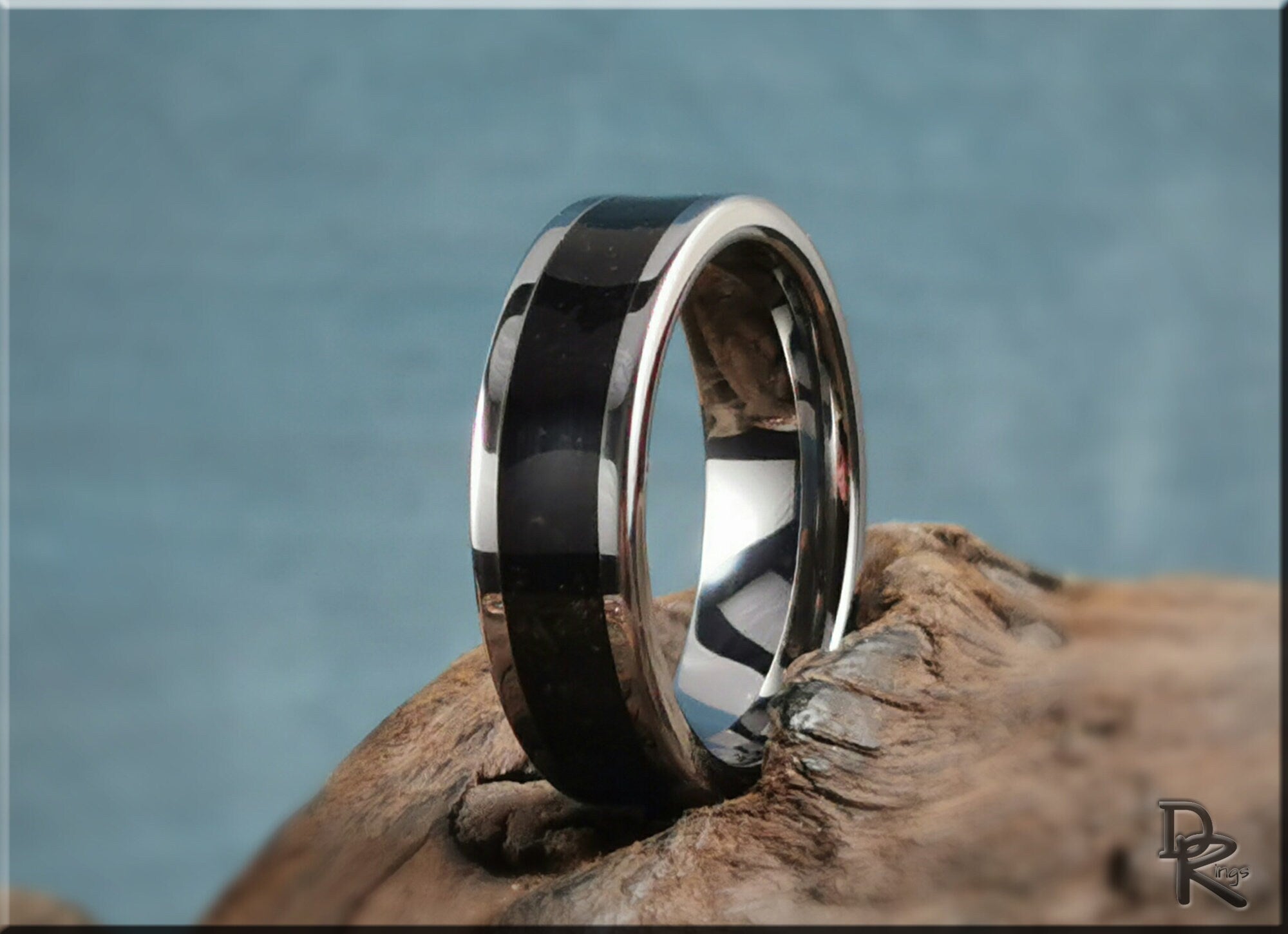 DR Rings tungsten ring with shungite featuring a polished silver edge and dark stone inlay