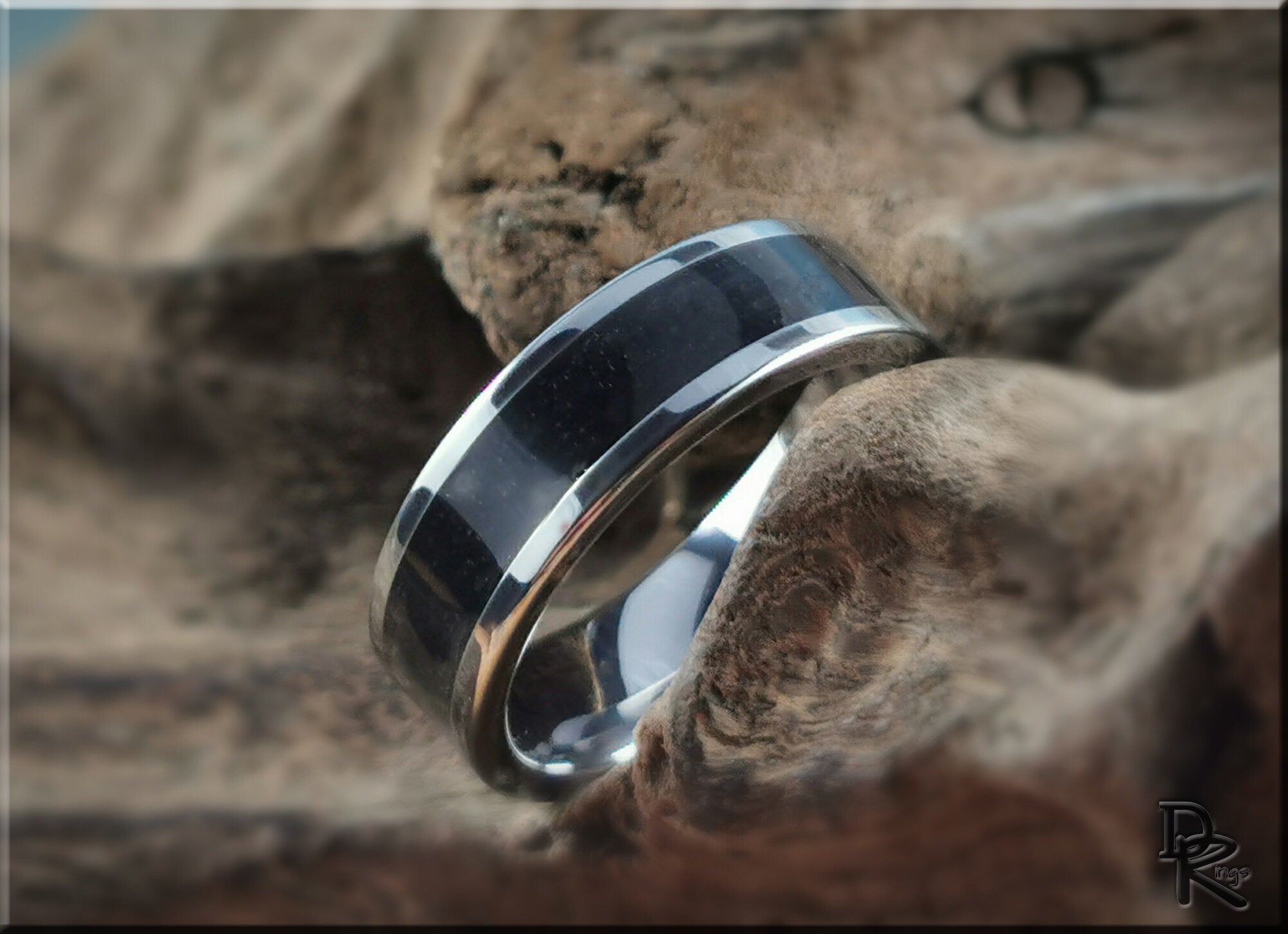 DR Rings tungsten ring with shungite featuring a polished black stone inlay and silver edges