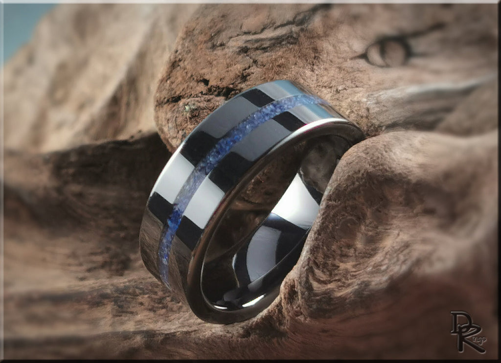 DR Rings black ceramic ring with blue inlay displayed on textured natural wood background
