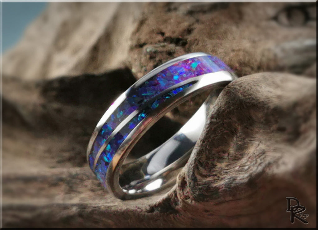 DR Rings titanium ring with opal blue and purple inlay on textured natural background