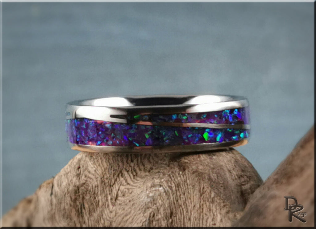 DR Rings titanium ring with opal featuring iridescent blue and green inlay on a polished band