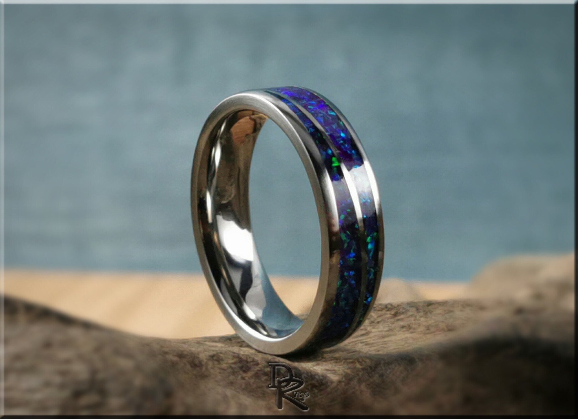 DR Rings titanium ring with opal featuring blue and green opal inlay with a polished silver band