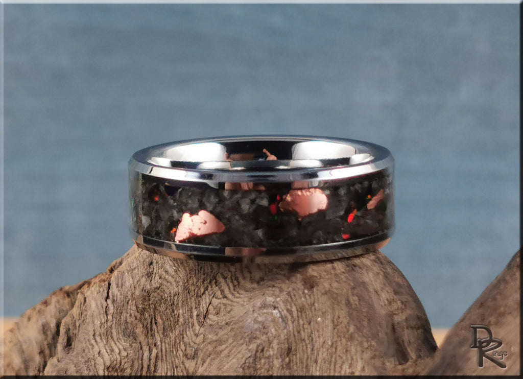 DR Rings tungsten ring carbide with yooperlite featuring black and copper inlay on wood background