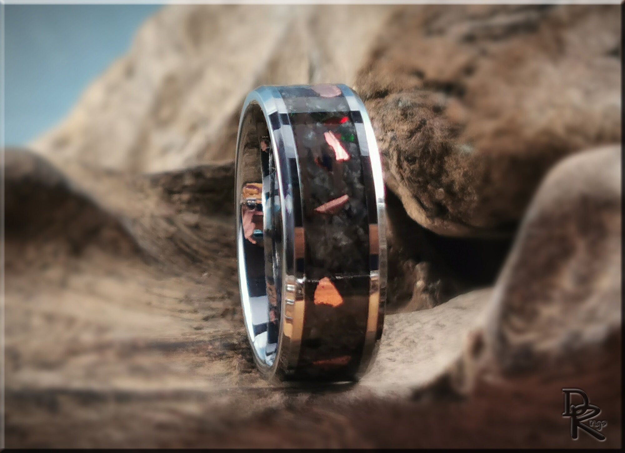 Tungsten ring carbide with yooperlite featuring polished silver edges and unique stone inlay